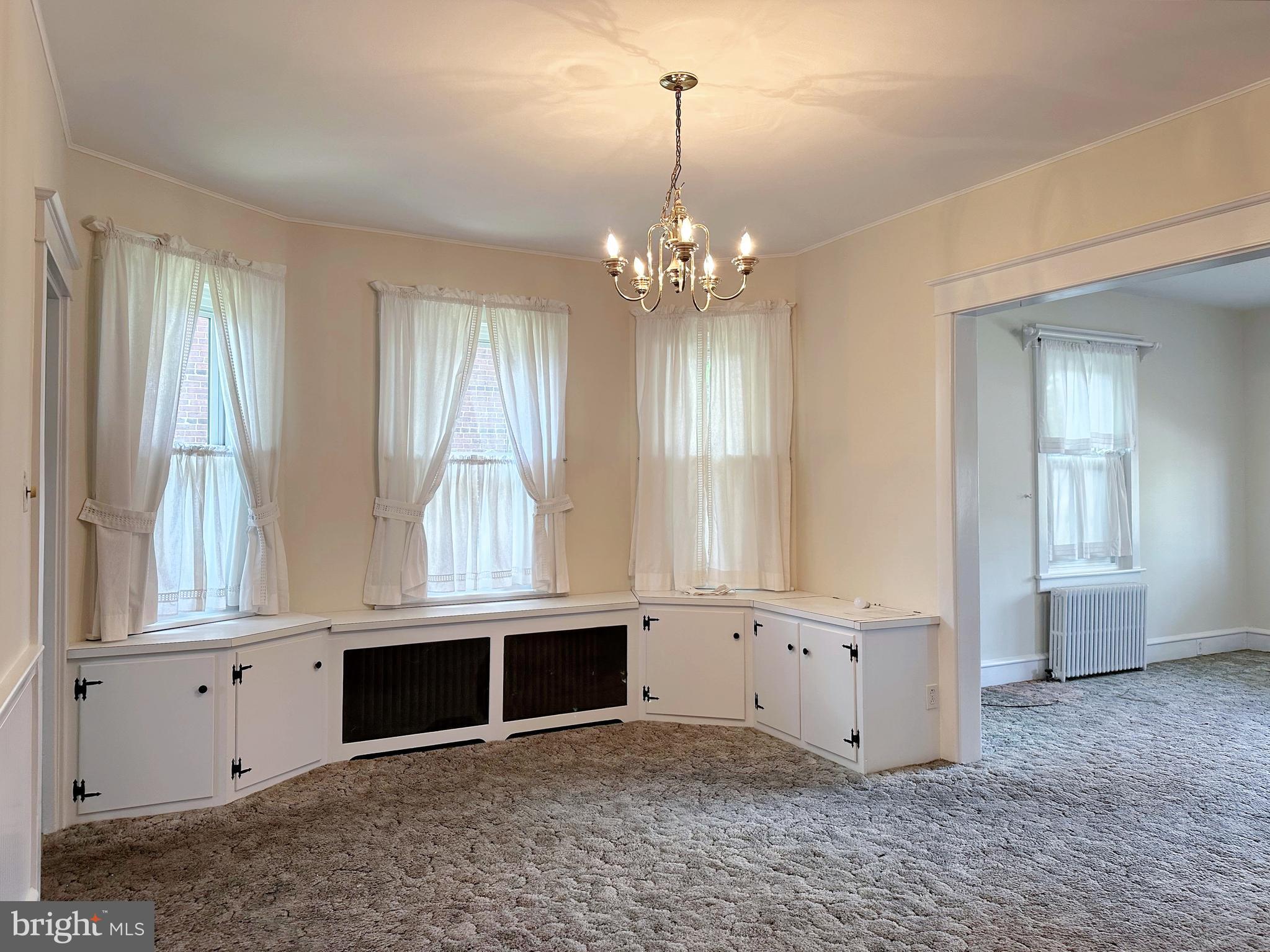 634 Main Street Red Hill, PA 18076 - Photo 15 of 34 a view of an empty room with window and cabinet area
