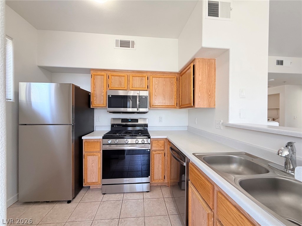 9050 West Warm Springs Road, Unit 2002 Las Vegas, NV 89148 - Photo 9 of 46 This spacious kitchen offers ample cabinet space and modern stainless steel appliances.