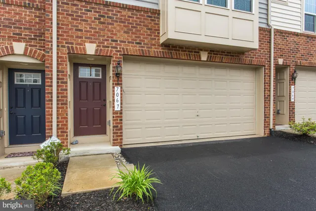 a view of a house with a garage