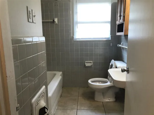 a bathroom with a toilet and a sink