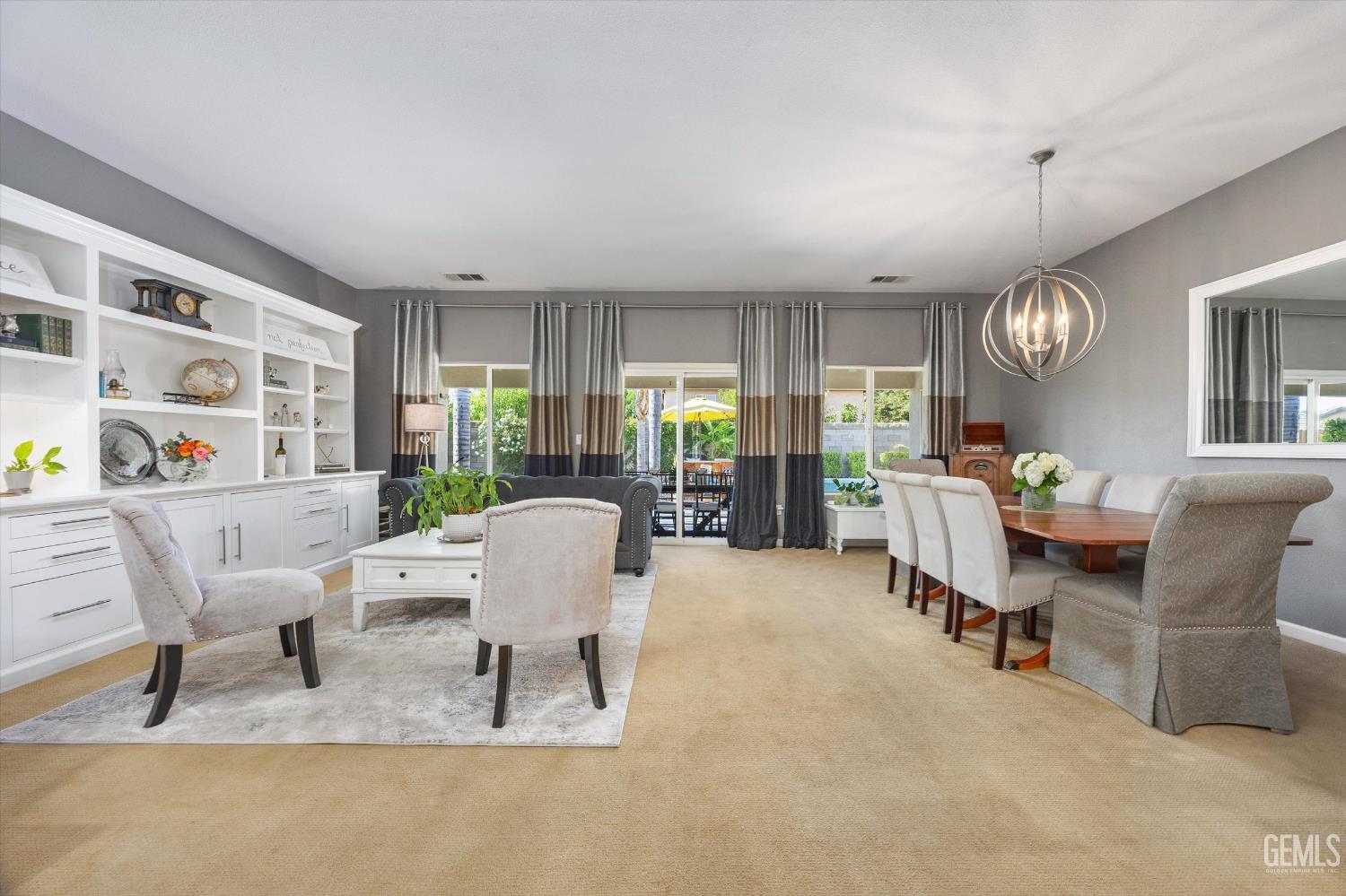 Undisclosed Address Bakersfield, CA 93312 - Photo 14 of 61 a living room with furniture a table and a large window