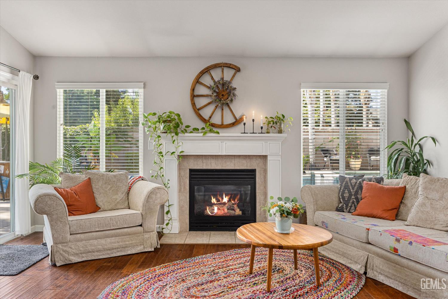 Undisclosed Address Bakersfield, CA 93312 - Photo 23 of 61 a living room with furniture a window and a fireplace