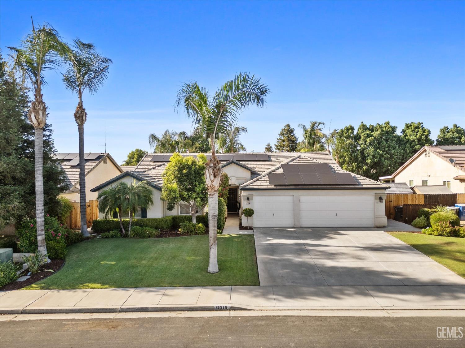 Undisclosed Address Bakersfield, CA 93312 - Photo 3 of 61 front view of a house with a yard