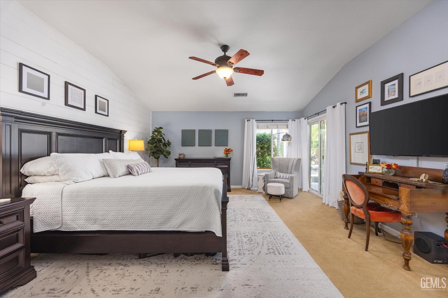 Undisclosed Address Bakersfield, CA 93312 - Photo 34 of 61 a living room with furniture a flat screen tv and a large window