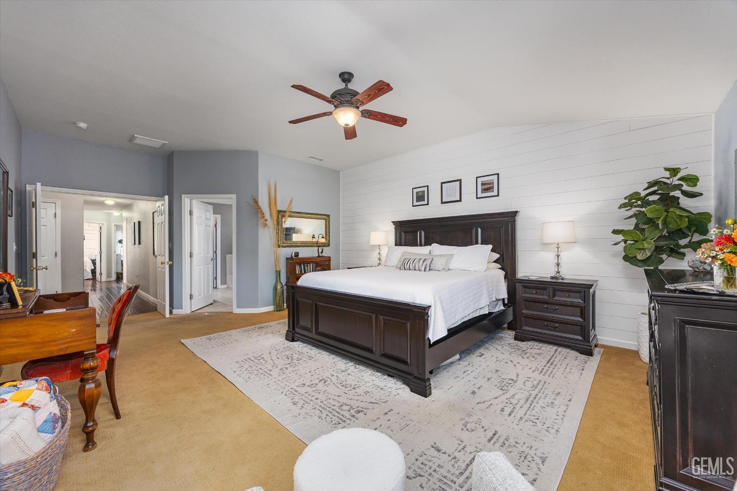 Undisclosed Address Bakersfield, CA 93312 - Photo 35 of 61 a bedroom with a bed and a chandelier