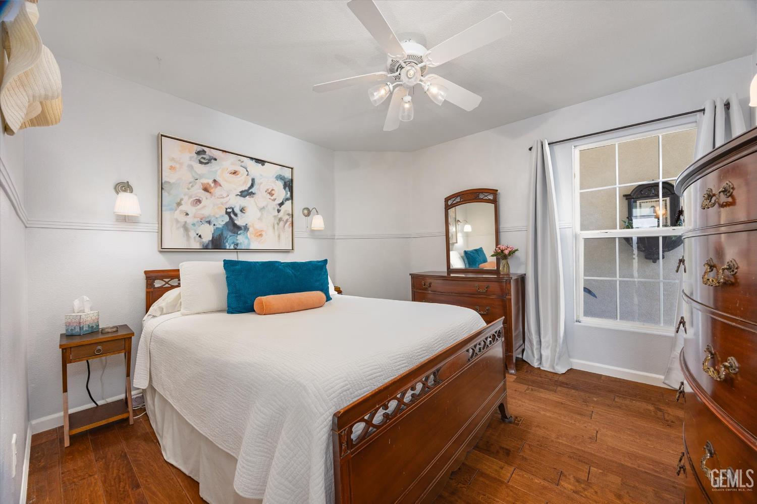 Undisclosed Address Bakersfield, CA 93312 - Photo 40 of 61 a bedroom with a bed and a chandelier