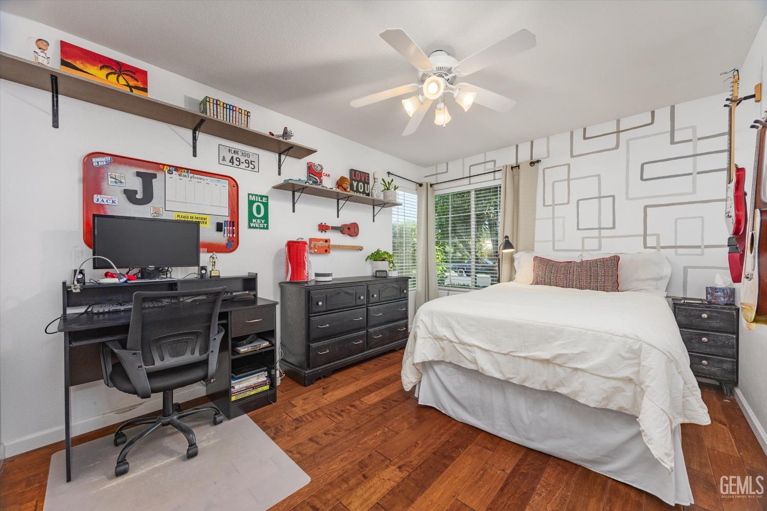 Undisclosed Address Bakersfield, CA 93312 - Photo 46 of 61 a bedroom with a bed and a chandelier