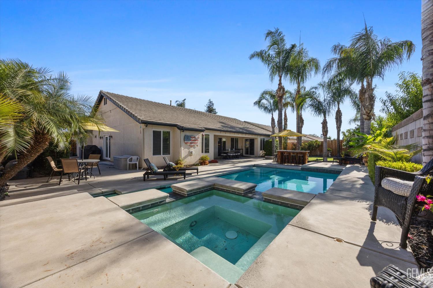 Undisclosed Address Bakersfield, CA 93312 - Photo 56 of 61 a view of a house with swimming pool and sitting area