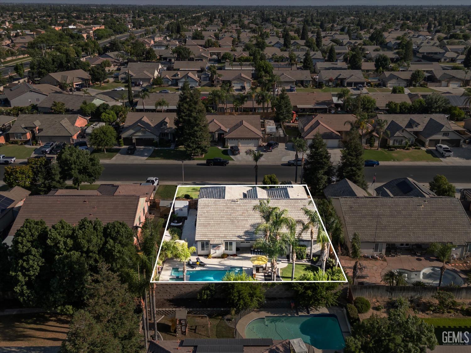 Undisclosed Address Bakersfield, CA 93312 - Photo 60 of 61 an aerial view of a house with a swimming pool outdoor seating and yard