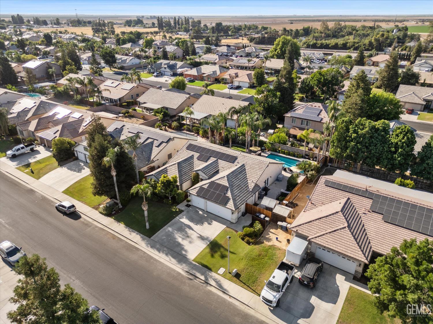 Undisclosed Address Bakersfield, CA 93312 - Photo 7 of 61 an aerial view of a house with a swimming pool
