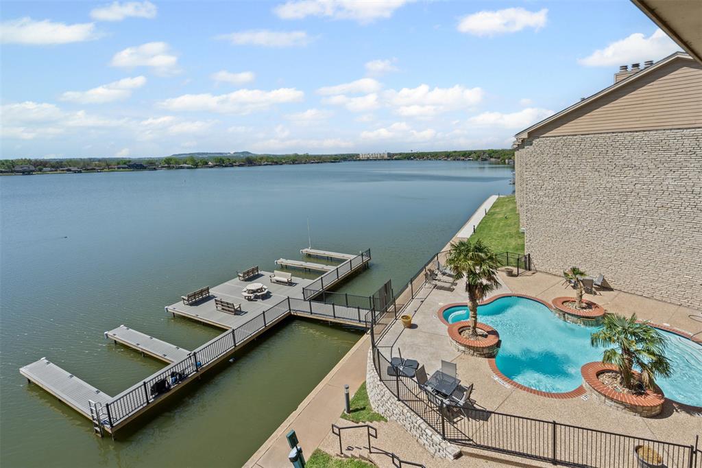 401 East Pearl Street, Unit 2306 Granbury, TX 76048 - Photo 4 of 17 Renovated community boat dock, sea wall, and fenced community pool