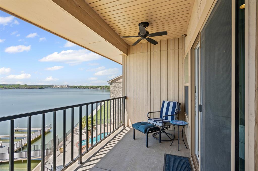 401 East Pearl Street, Unit 2306 Granbury, TX 76048 - Photo 5 of 17 Balcony with a water view and ceiling fan