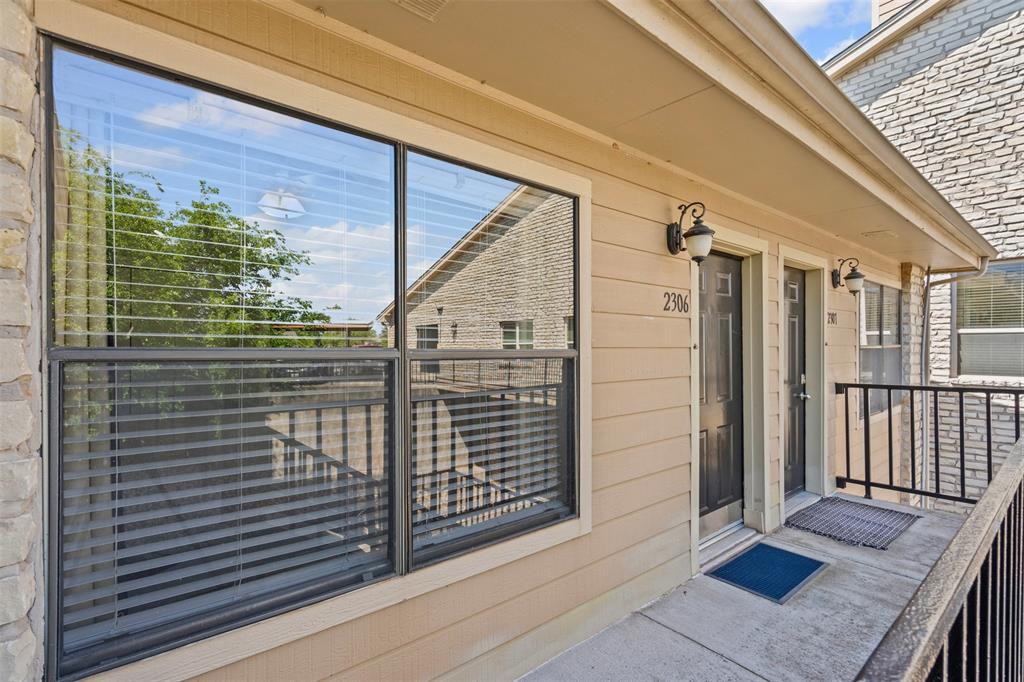 401 East Pearl Street, Unit 2306 Granbury, TX 76048 - Photo 6 of 17 Walkway to entrance of the Condo