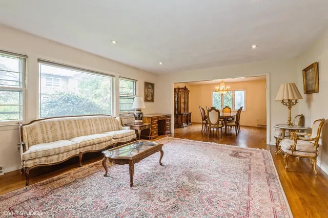 a living room with furniture and a table