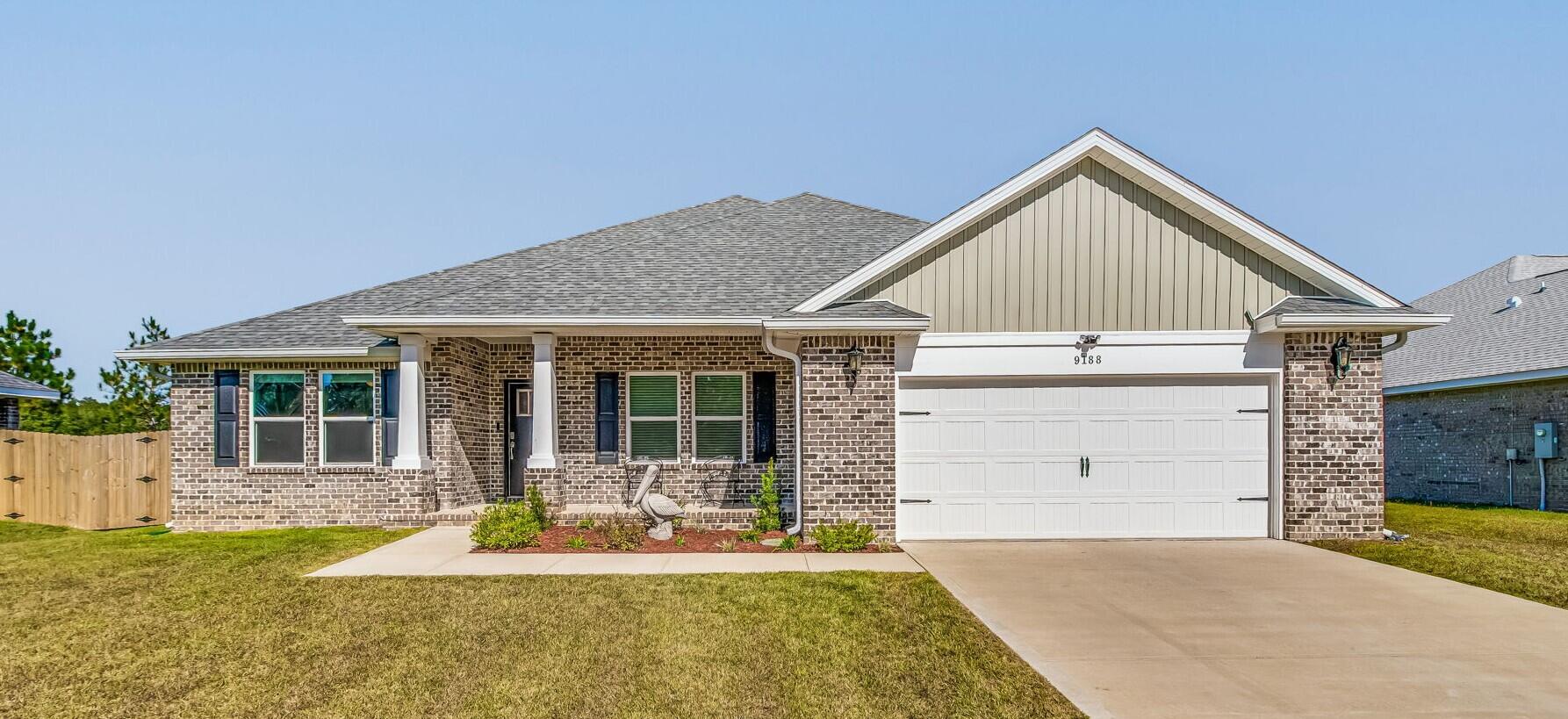 front view of a house with a yard