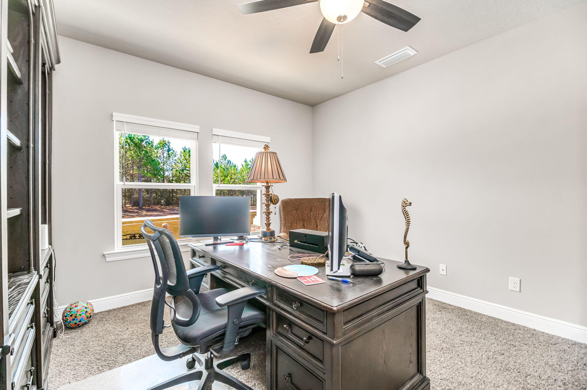 9188 Trident Road Milton, FL 32583 - Photo 14 of 47 a view of a workspace with furniture and a window