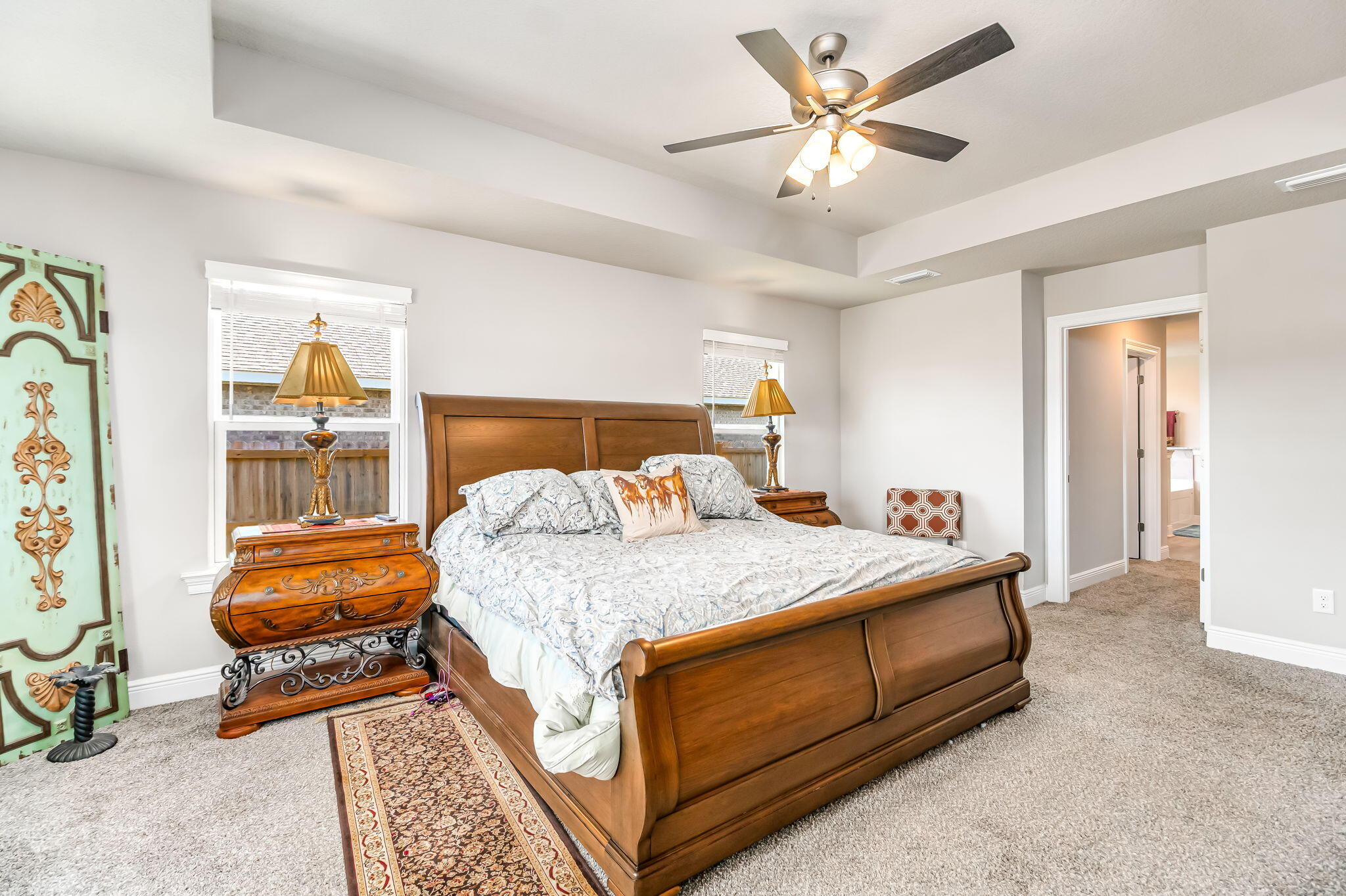 9188 Trident Road Milton, FL 32583 - Photo 16 of 47 a bedroom with a bed and a chandelier