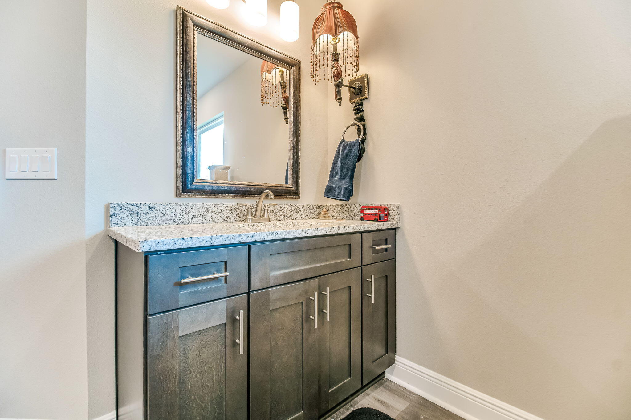 9188 Trident Road Milton, FL 32583 - Photo 20 of 47 a bathroom with a sink vanity and a mirror