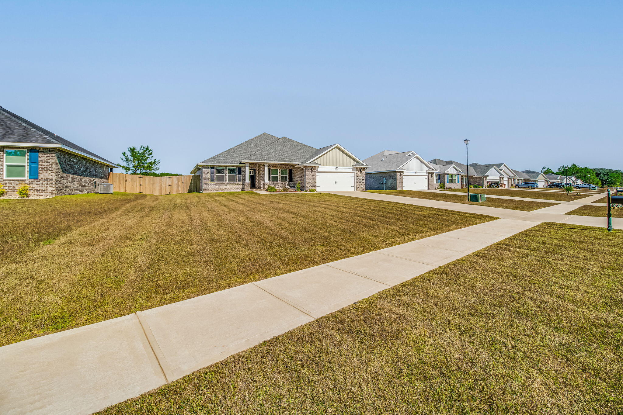 9188 Trident Road Milton, FL 32583 - Photo 2 of 47 a view of an house with backyard and trees