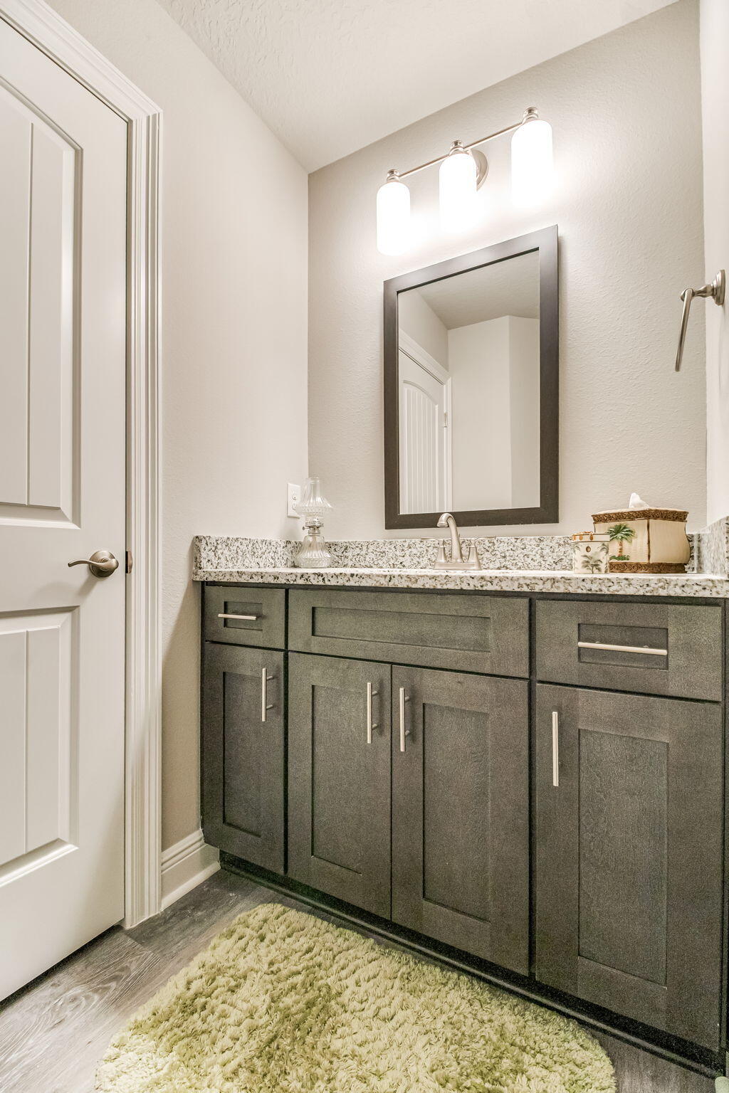 9188 Trident Road Milton, FL 32583 - Photo 25 of 47 a bathroom with a granite countertop sink and a mirror
