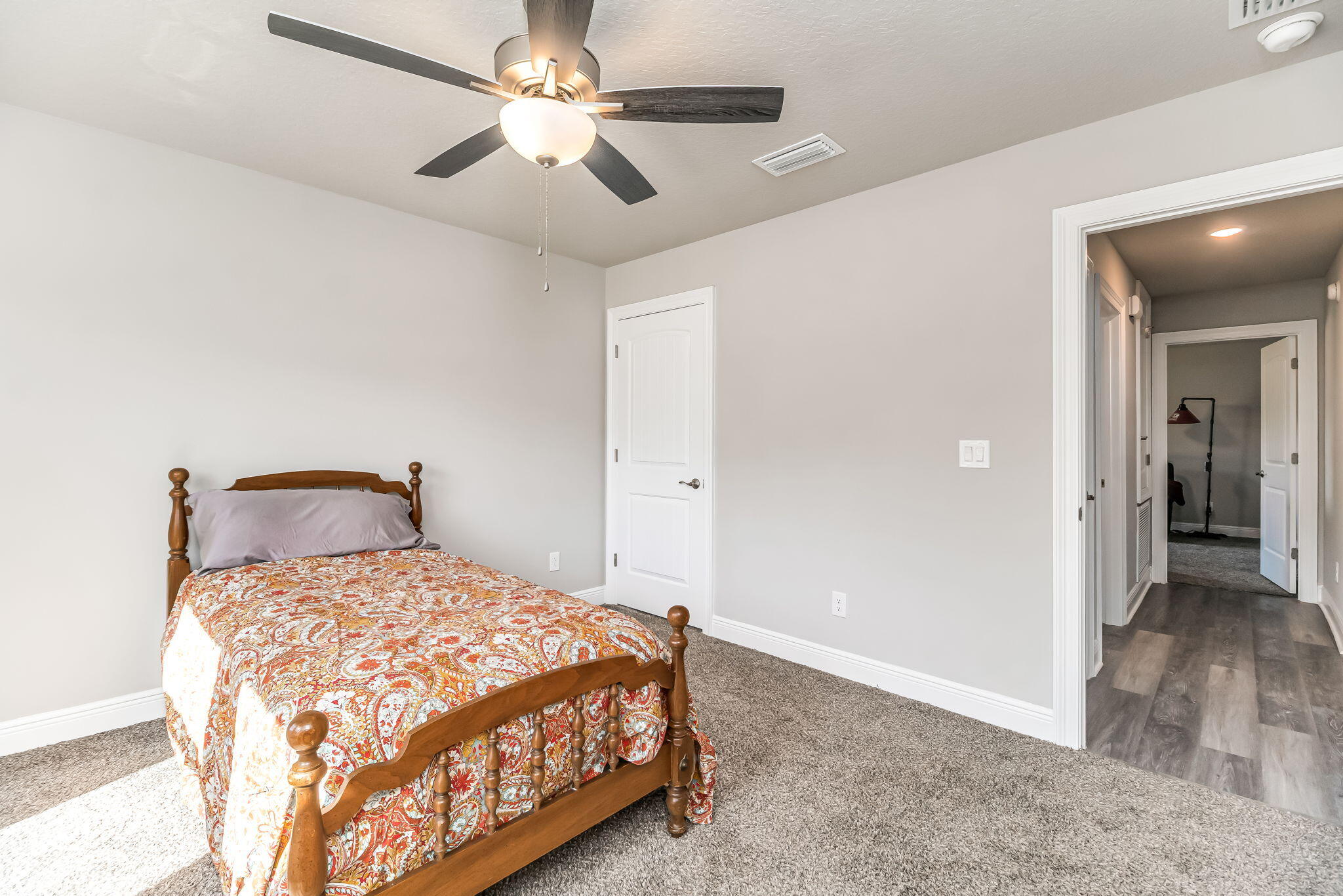 9188 Trident Road Milton, FL 32583 - Photo 27 of 47 a bedroom with a bed and a ceiling fan