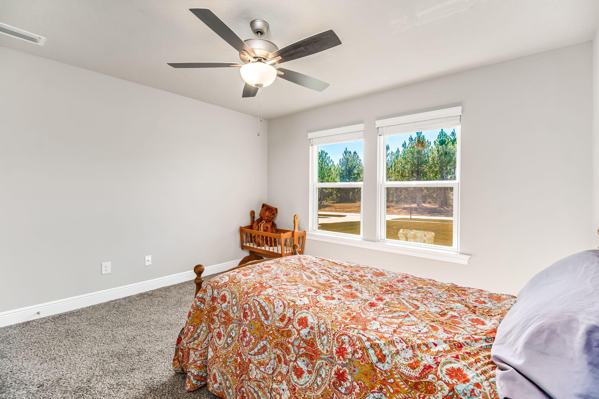 9188 Trident Road Milton, FL 32583 - Photo 28 of 47 a bedroom with a bed and a large window