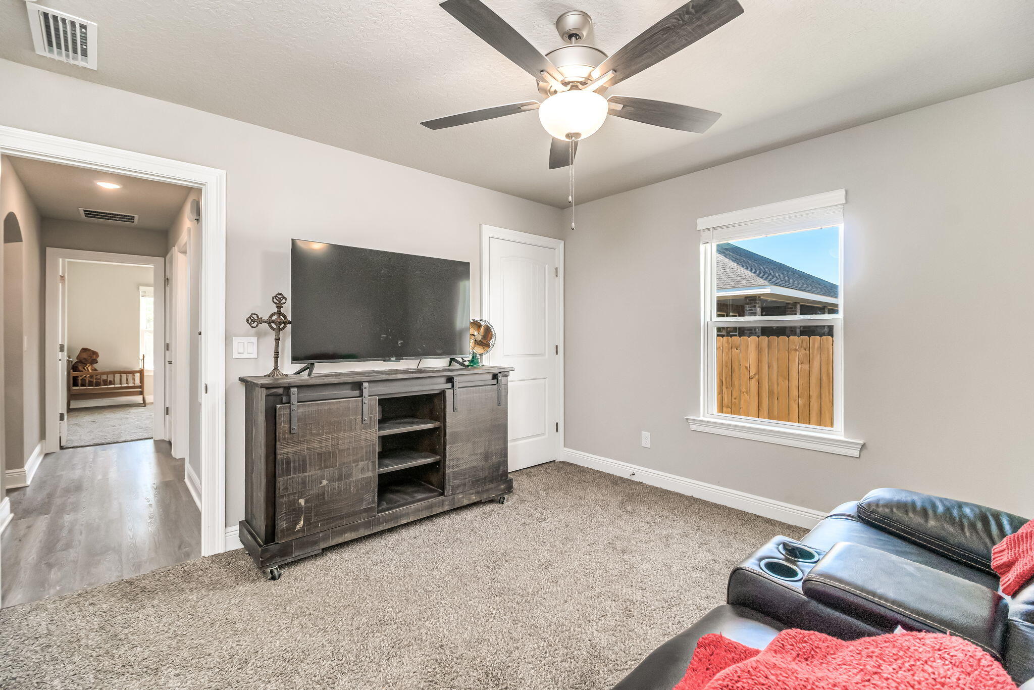 9188 Trident Road Milton, FL 32583 - Photo 30 of 47 a living room with furniture and a flat screen tv