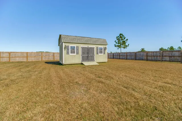 a view of a room with wooden floor and sliding door