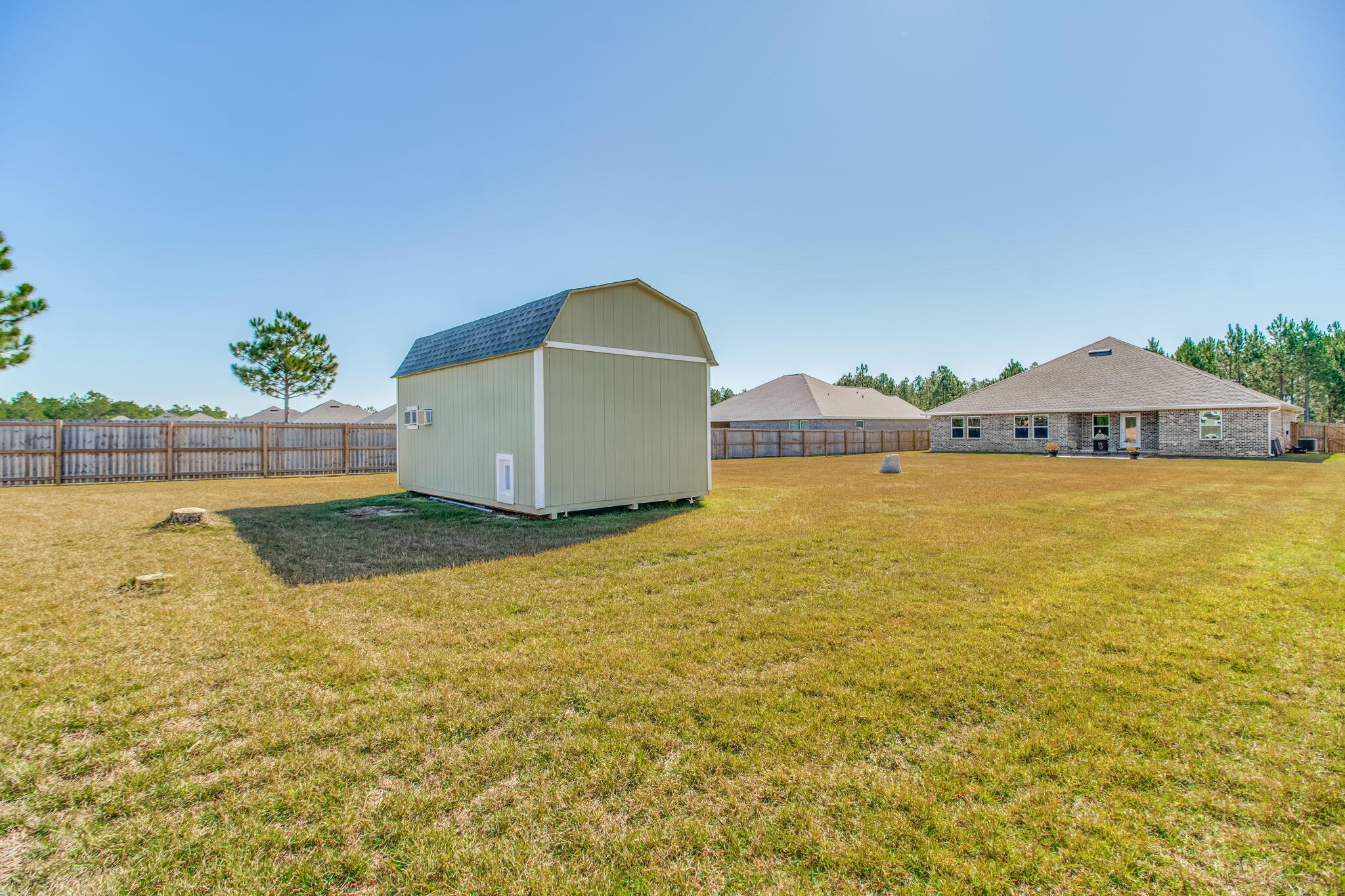 9188 Trident Road Milton, FL 32583 - Photo 41 of 47 a view of a swimming pool with an outdoor space and seating area