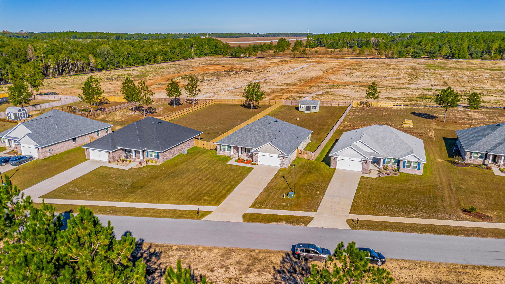 9188 Trident Road Milton, FL 32583 - Photo 42 of 47 an aerial view of residential houses with outdoor space