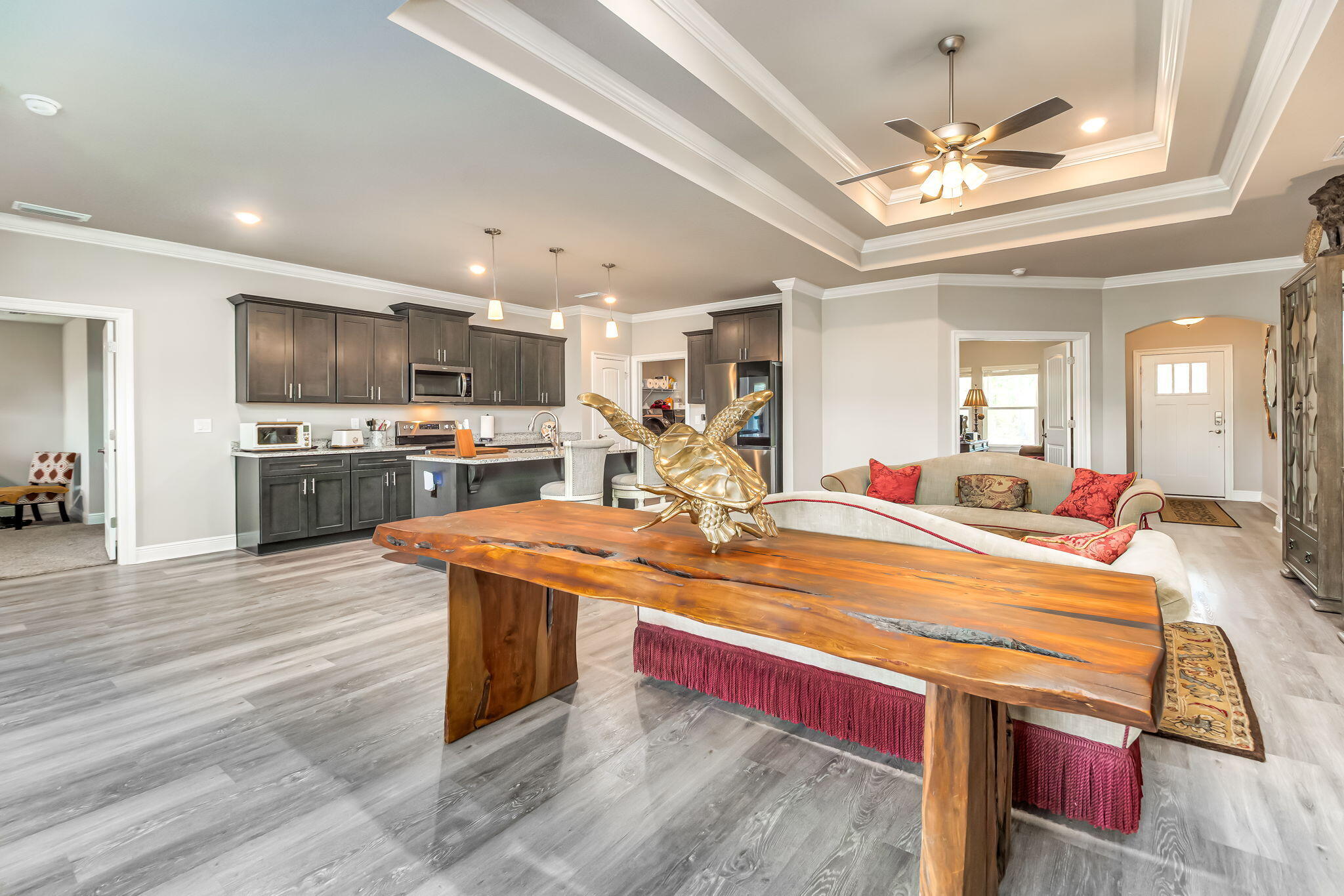 9188 Trident Road Milton, FL 32583 - Photo 6 of 47 a room with stainless steel appliances granite countertop a kitchen island a stove and a sink