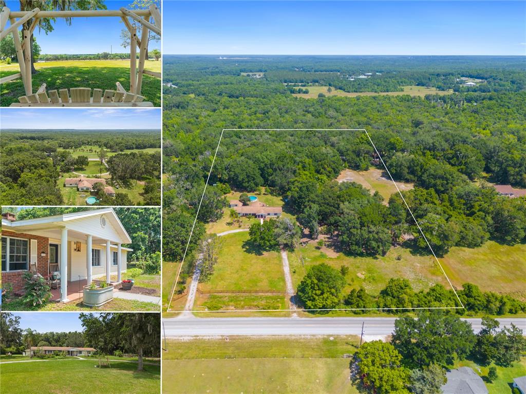 an aerial view of residential houses with outdoor space and swimming pool