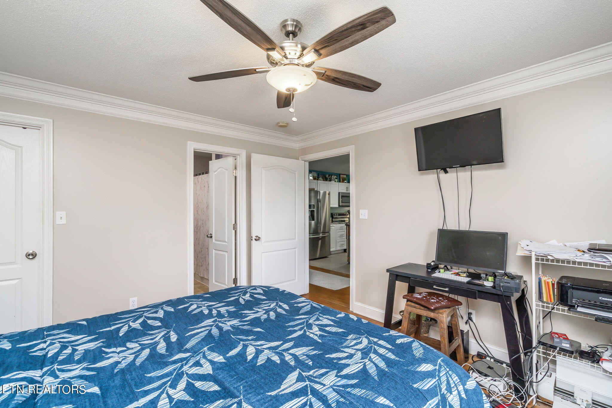 705 High Point Way, Knoxville, TN 37912 - Photo 14 of 22 a bedroom with a bed and a flat screen tv