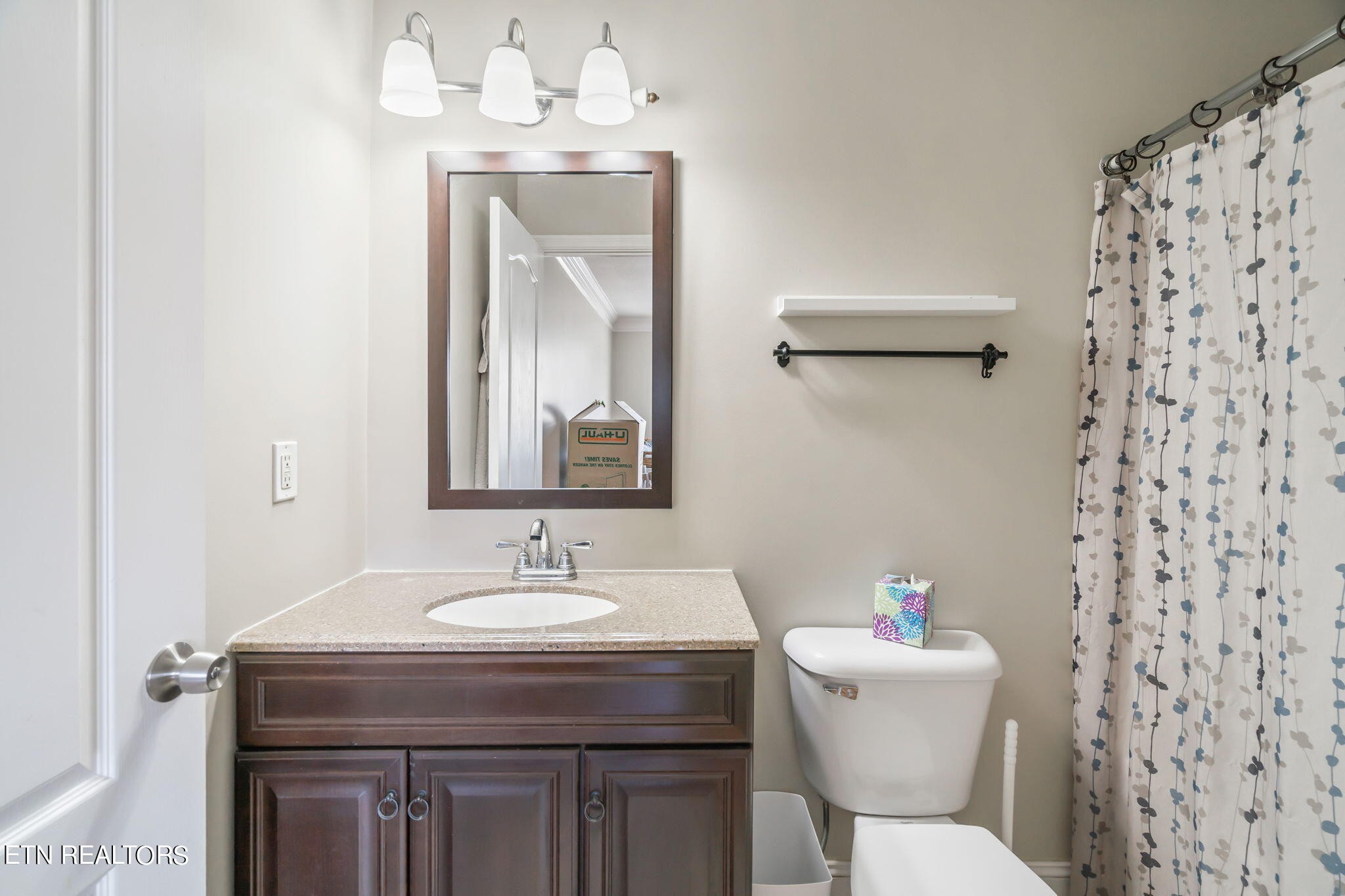 705 High Point Way, Knoxville, TN 37912 - Photo 15 of 22 a bathroom with a sink a toilet and a mirror