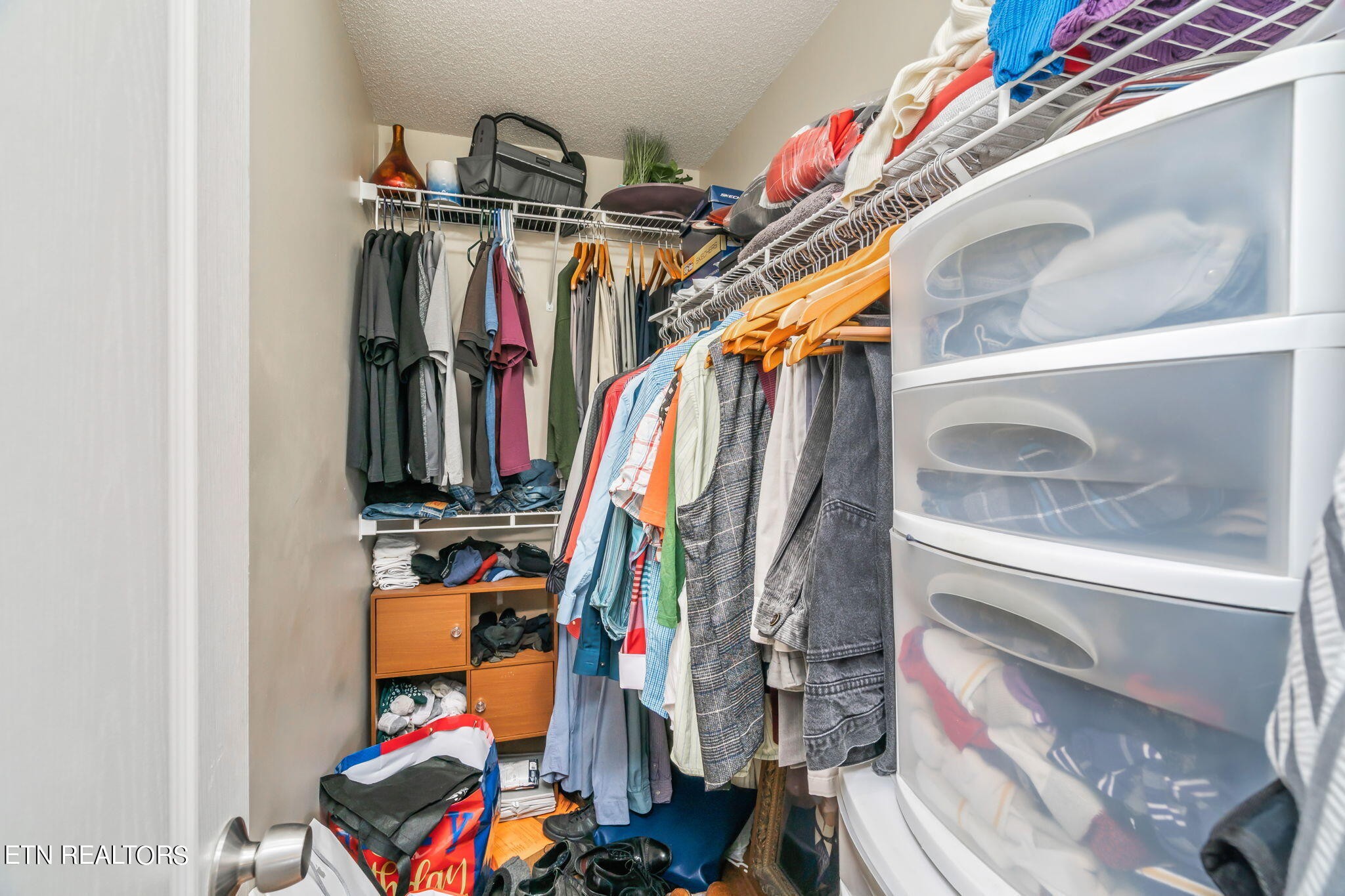 705 High Point Way, Knoxville, TN 37912 - Photo 18 of 22 a view of walk in closet with clothes and shoes