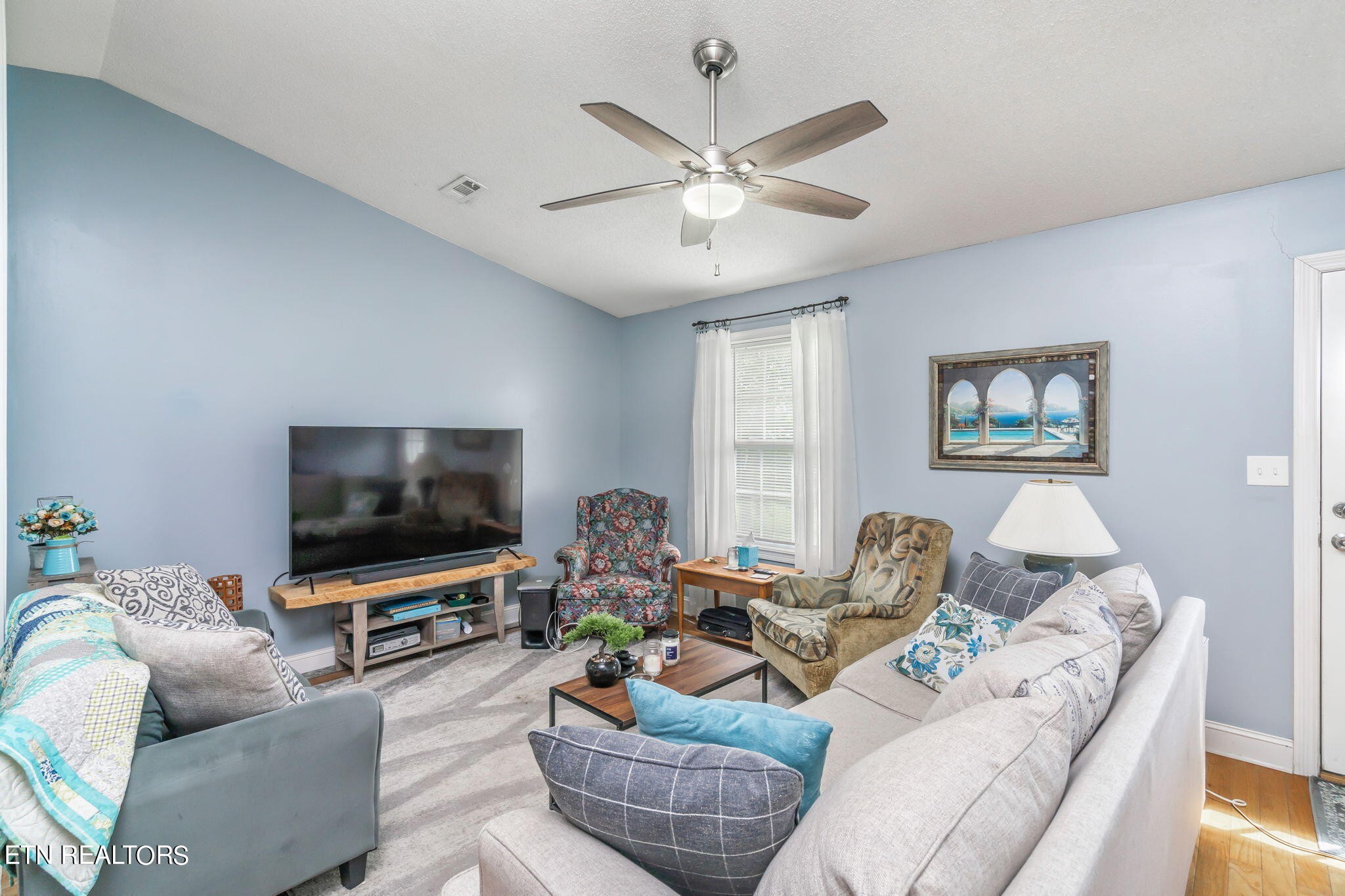 705 High Point Way, Knoxville, TN 37912 - Photo 5 of 22 a living room with furniture and a flat screen tv