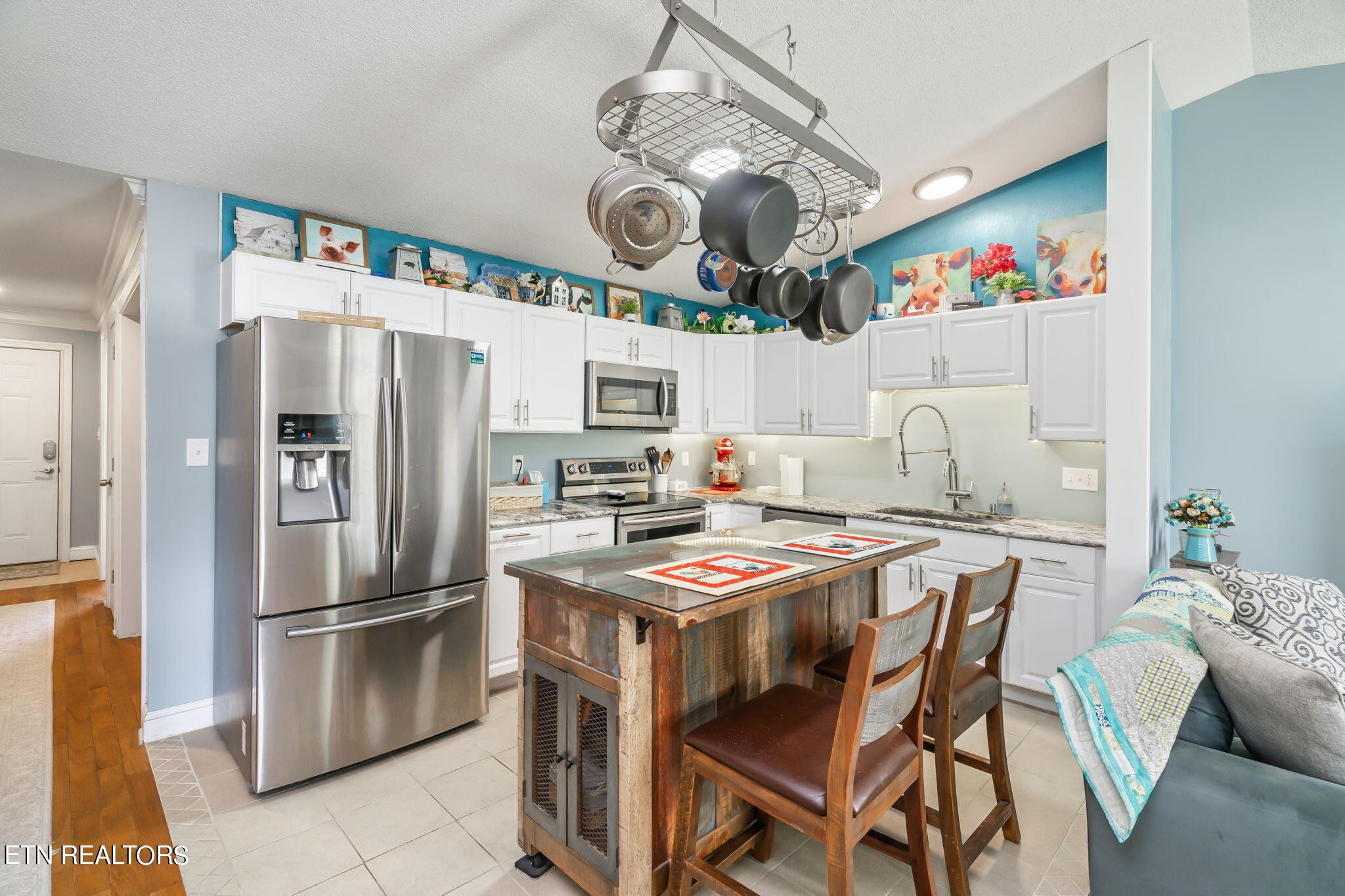 705 High Point Way, Knoxville, TN 37912 - Photo 7 of 22 a kitchen with stainless steel appliances granite countertop a sink a stove a refrigerator and a chandelier