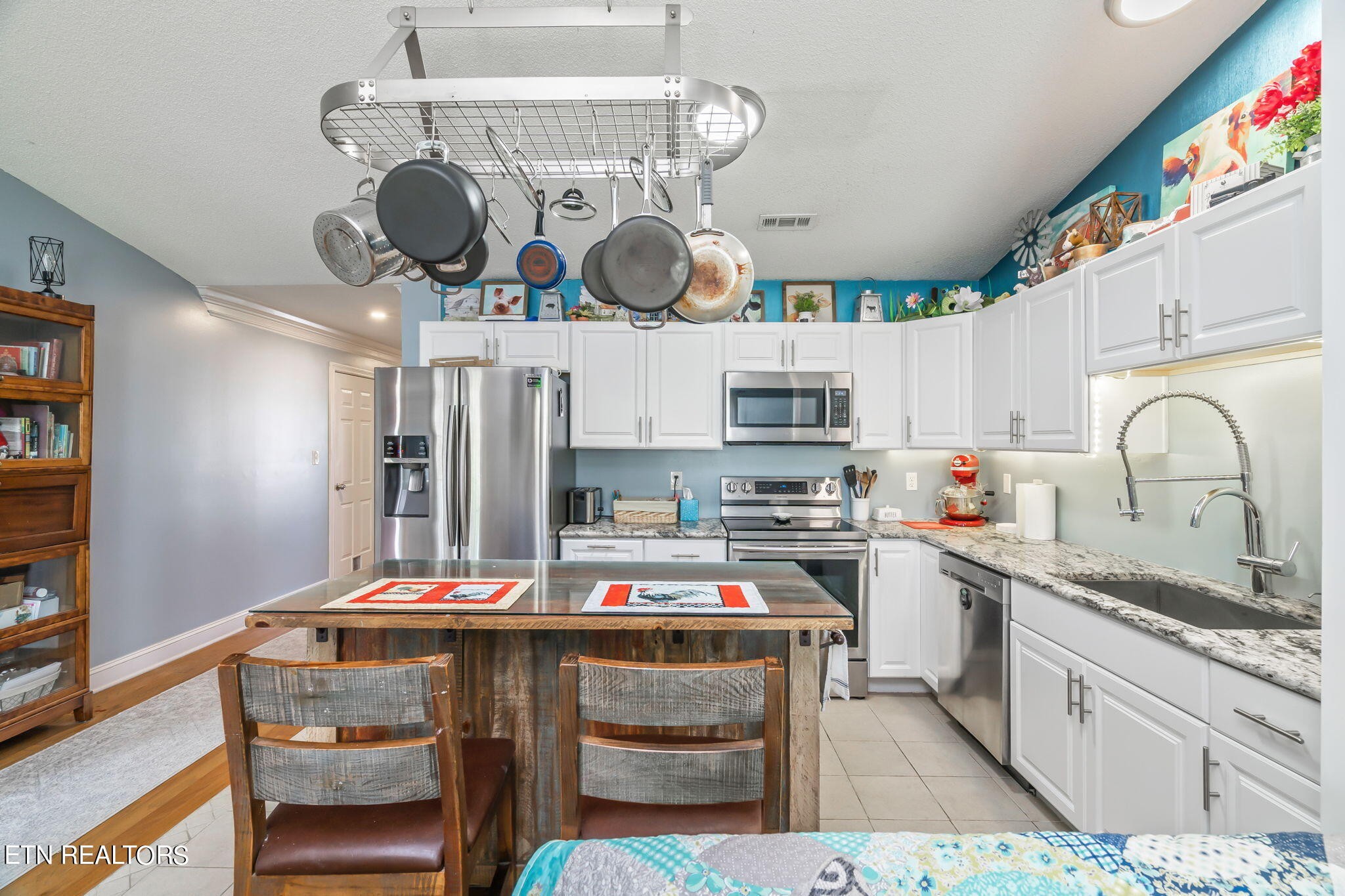 705 High Point Way, Knoxville, TN 37912 - Photo 8 of 22 a kitchen with kitchen island stainless steel appliances a sink and stove