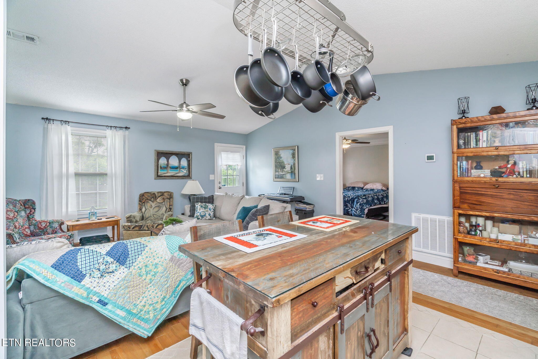 705 High Point Way, Knoxville, TN 37912 - Photo 10 of 22 a living room with a table chairs and a chandelier