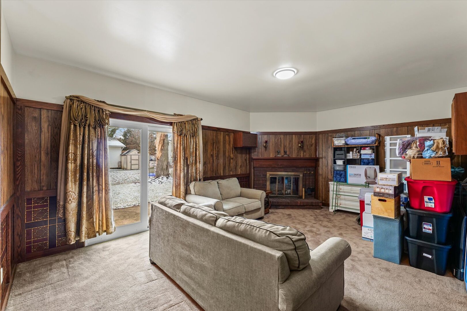 2307 Branch Road Champaign, IL 61821 - Photo 11 of 26 a living room with furniture a fireplace and a flat screen tv