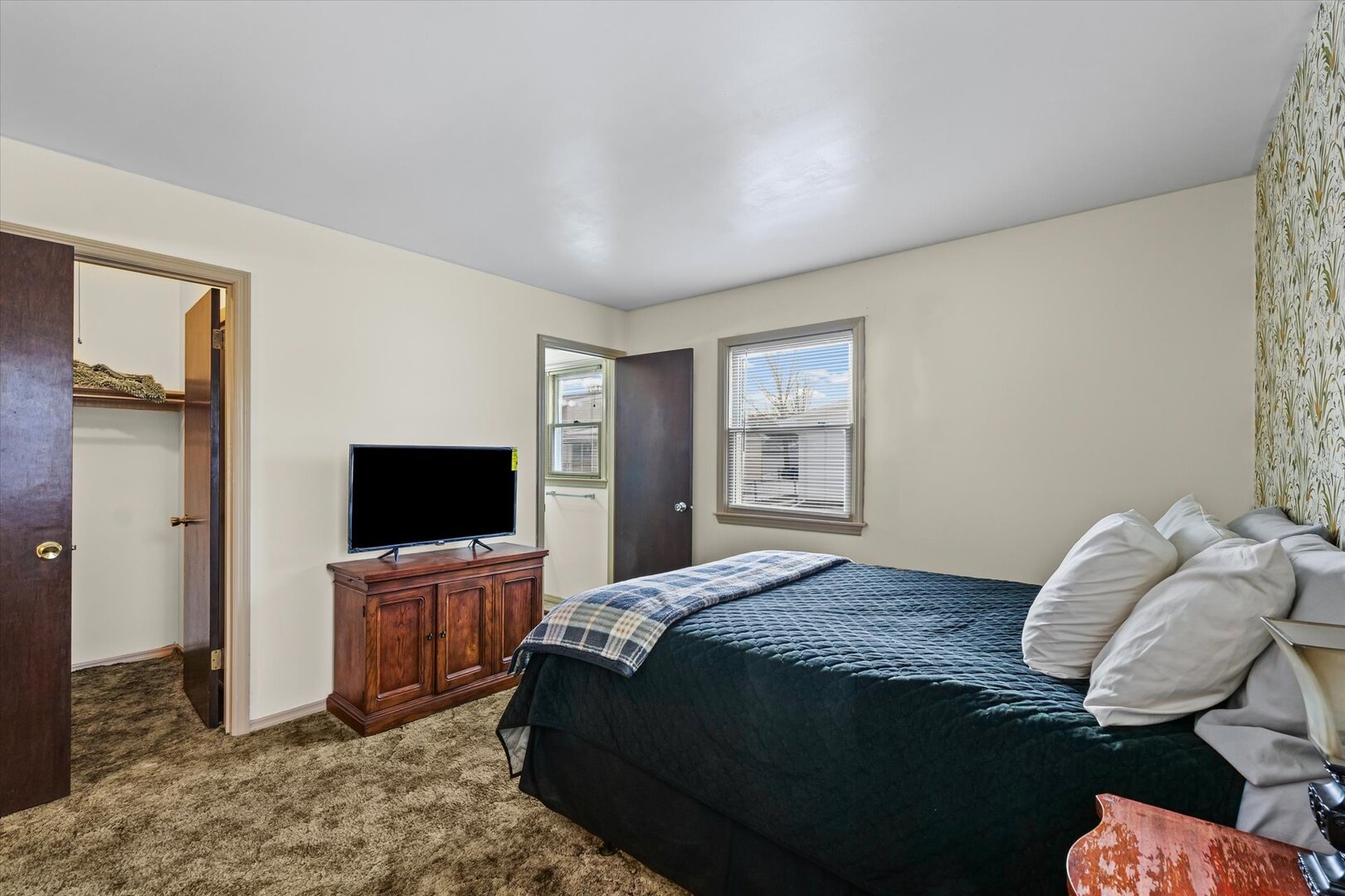 2307 Branch Road Champaign, IL 61821 - Photo 16 of 26 a bedroom with a bed and flat screen tv