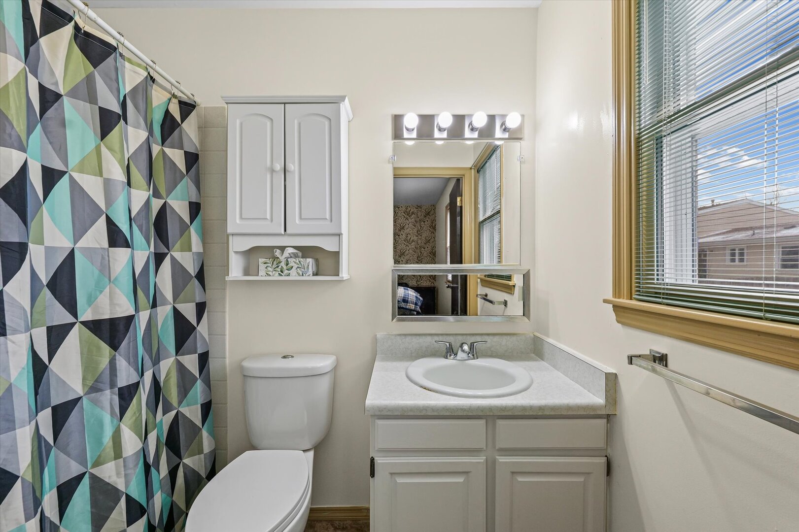 2307 Branch Road Champaign, IL 61821 - Photo 17 of 26 a bathroom with a sink a toilet and a mirror