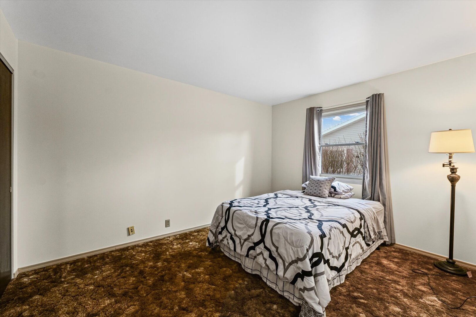 2307 Branch Road Champaign, IL 61821 - Photo 20 of 26 a bedroom with a bed and a window