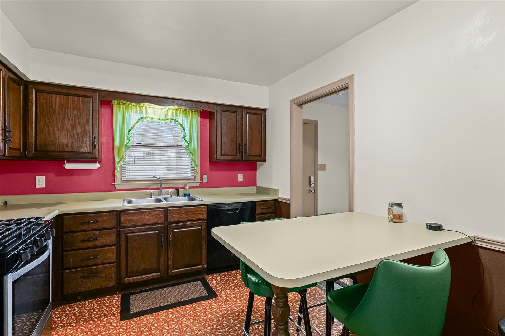 2307 Branch Road Champaign, IL 61821 - Photo 6 of 26 a kitchen with a table chairs sink and cabinets
