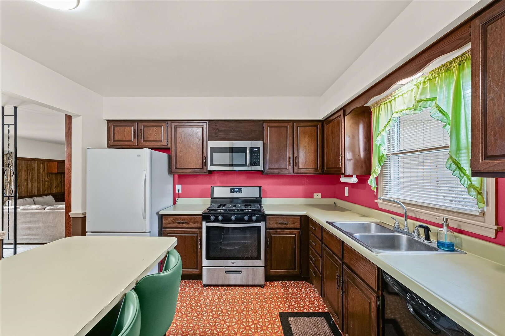 2307 Branch Road Champaign, IL 61821 - Photo 7 of 26 a kitchen with stainless steel appliances granite countertop a sink stove and refrigerator