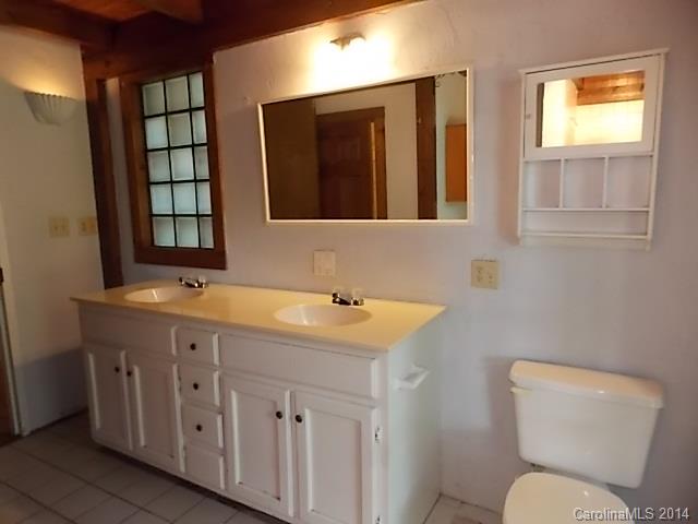 452 Lancaster Estate Road Fort Mill, SC 29707 - Photo 13 of 19 a bathroom with a toilet a sink and mirror