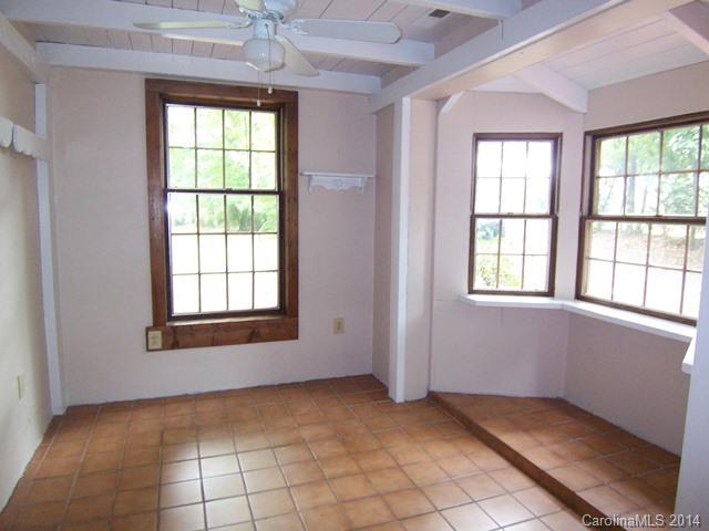 452 Lancaster Estate Road Fort Mill, SC 29707 - Photo 16 of 19 an empty room with chandelier fan and windows