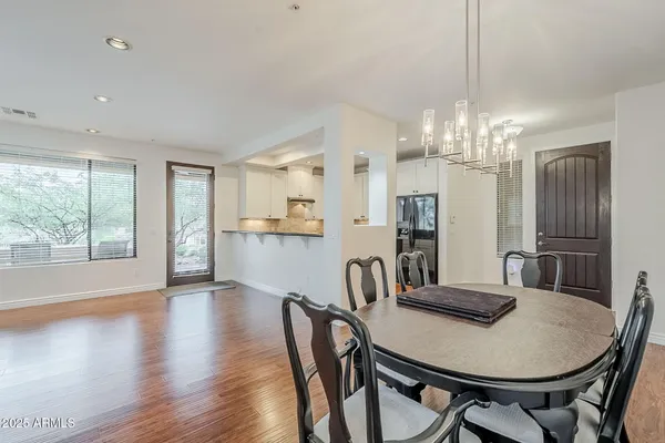 a view of a dining room with furniture window and wooden floor
