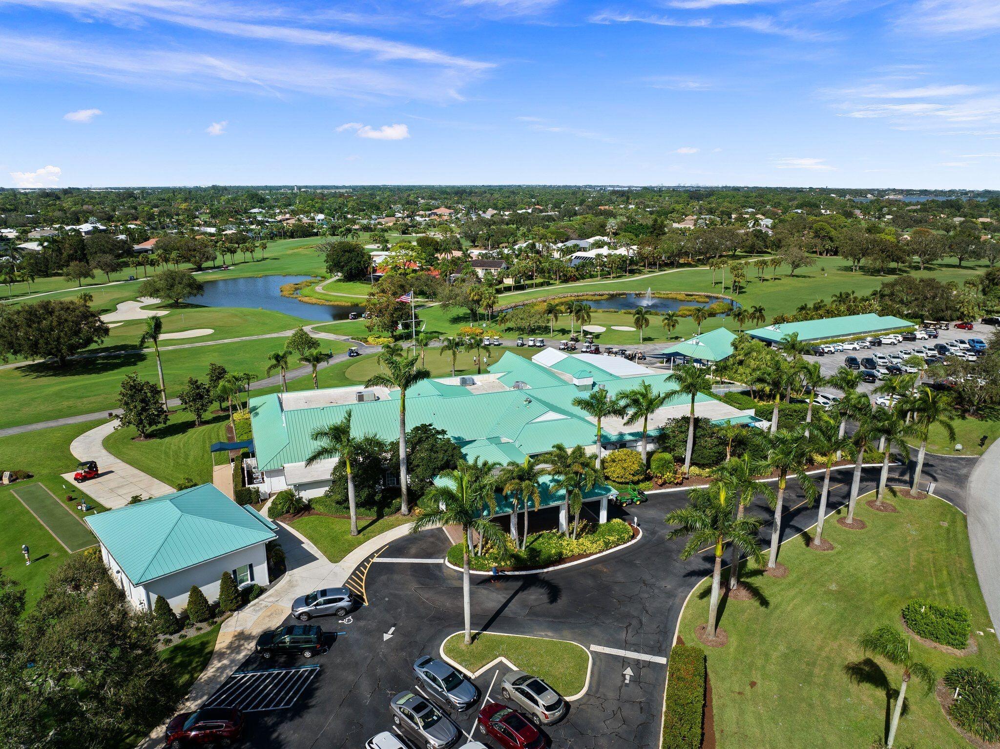 3374 Southeast Fairway East Stuart, FL 34997 - Photo 56 of 65 an aerial view of a house with a garden