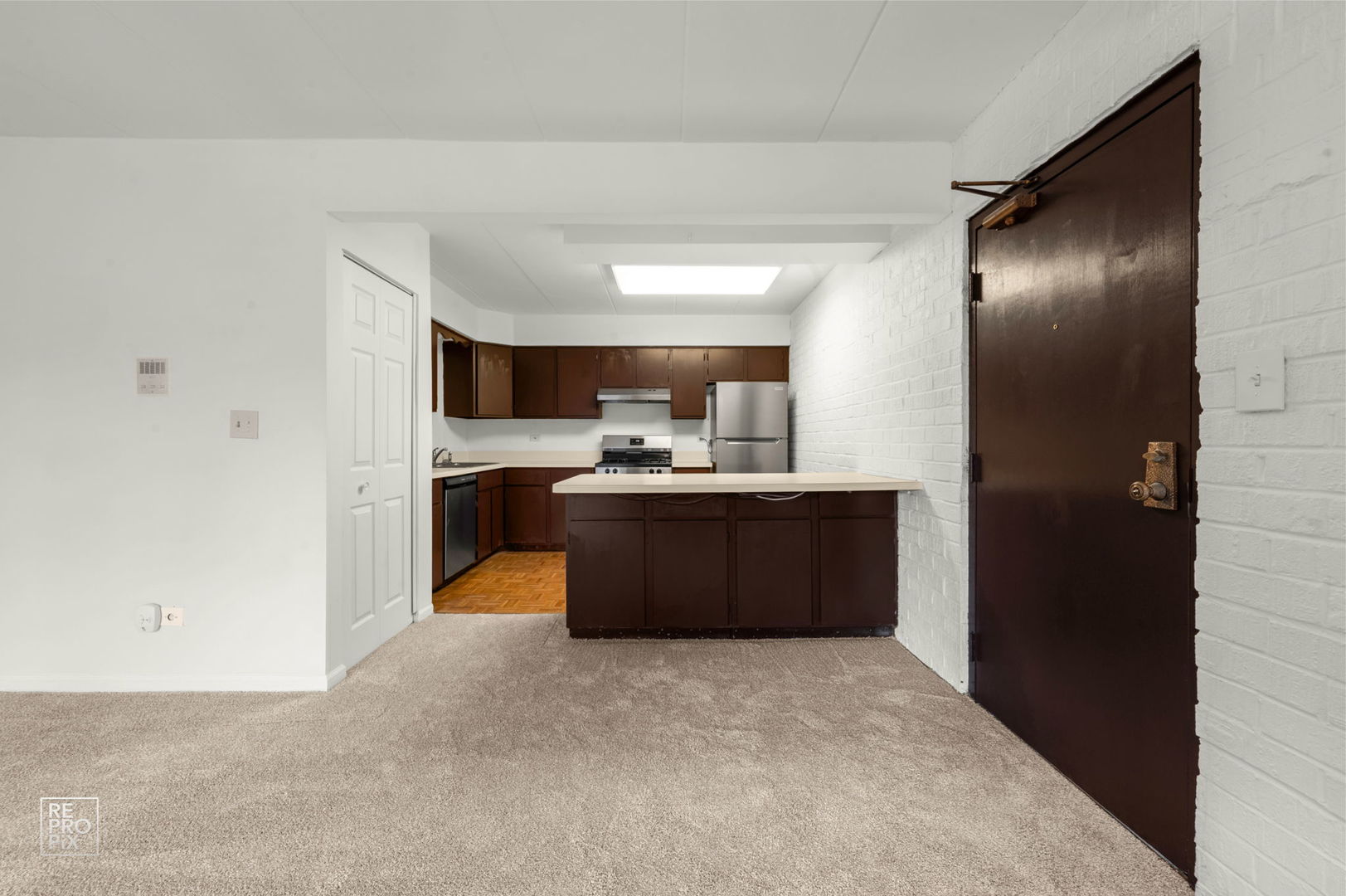 264 East Bailey Road, Unit E Naperville, IL 60565 - Photo 3 of 10 a kitchen with a refrigerator and a sink